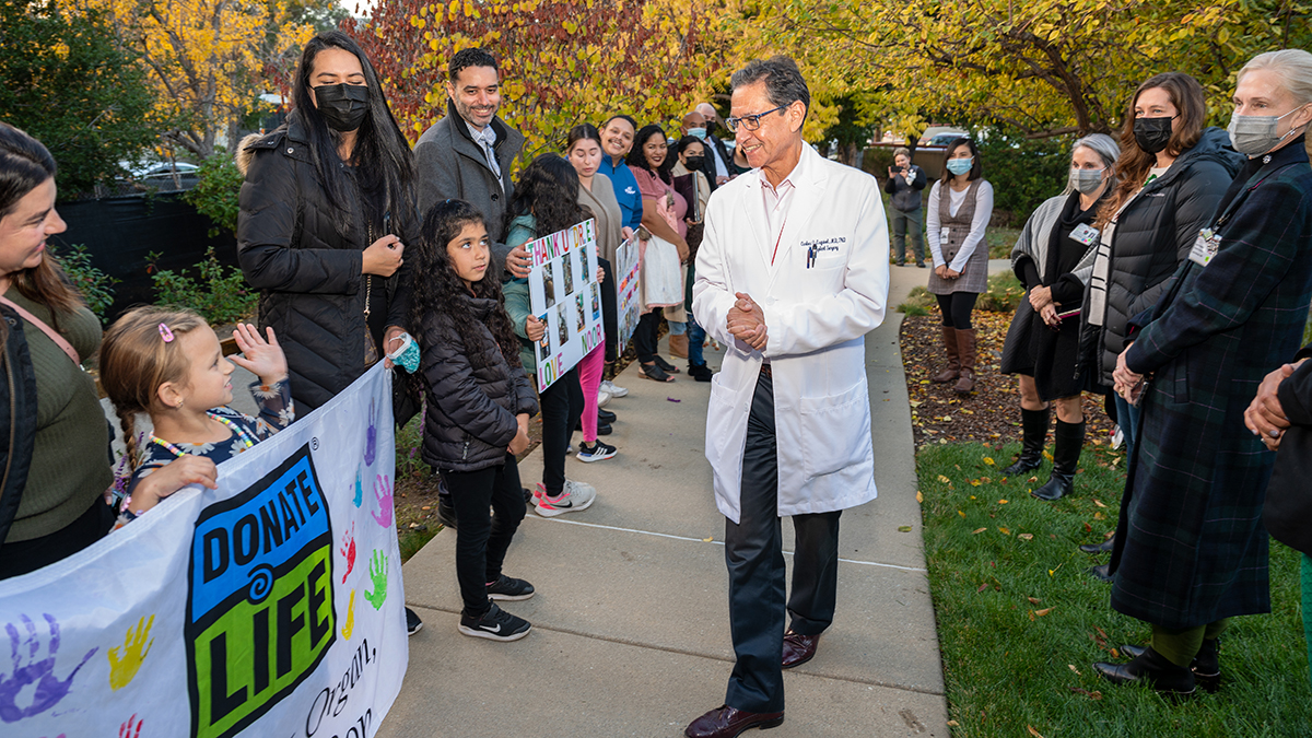 Dr Esquivel walking next to patients