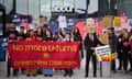 Protesters with banner reading 'no more U-turns, Green new deal now', while person in Keir Starmer costume puts a pieces of paper with 'promises to young people' written on it in a bin that is decorated with flames