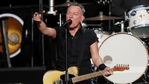 PA Media Bruce Springsteen on stage in concert