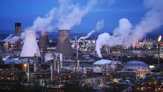 Aerial view of Grangemouth, with steam rising from a number of chimneys