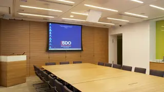 A room with BDO on a screen