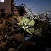 A man inspects a destroyed building that was hit by an Israeli airstrike in the southern suburbs of Beirut, Lebanon, Tuesday, July 30, 2024.