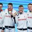 Tom Dean (R), Duncan Scott (C-L), Matthew Richards (C-R) and James Guy (L) of Great Britain Team celebrate after winning gold in the Men's 4x200m Freestyle Relay Final