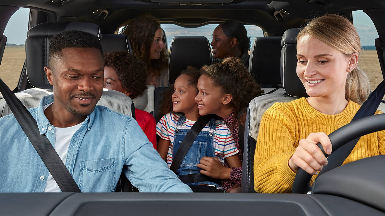 Family driving in Range Rover vehicle