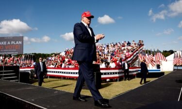 Former President Donald Trump walks off stage after speaking at a rally in Chesapeake