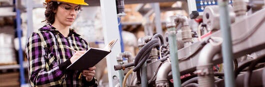 Female Engineer inspecting plant