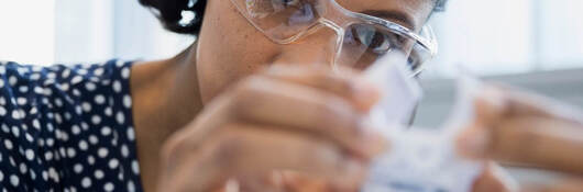 Woman scientist testing a sample