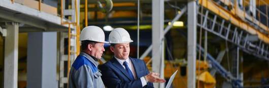 Two engineers in construction site