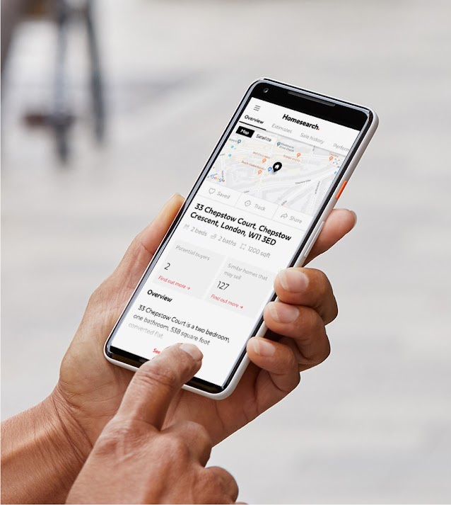 Person looking at Homesearch app on phone