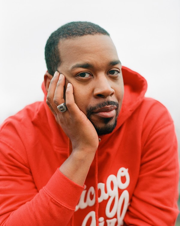 Diversify Photo co-founder Brent Lewis in a red sweatshirt.