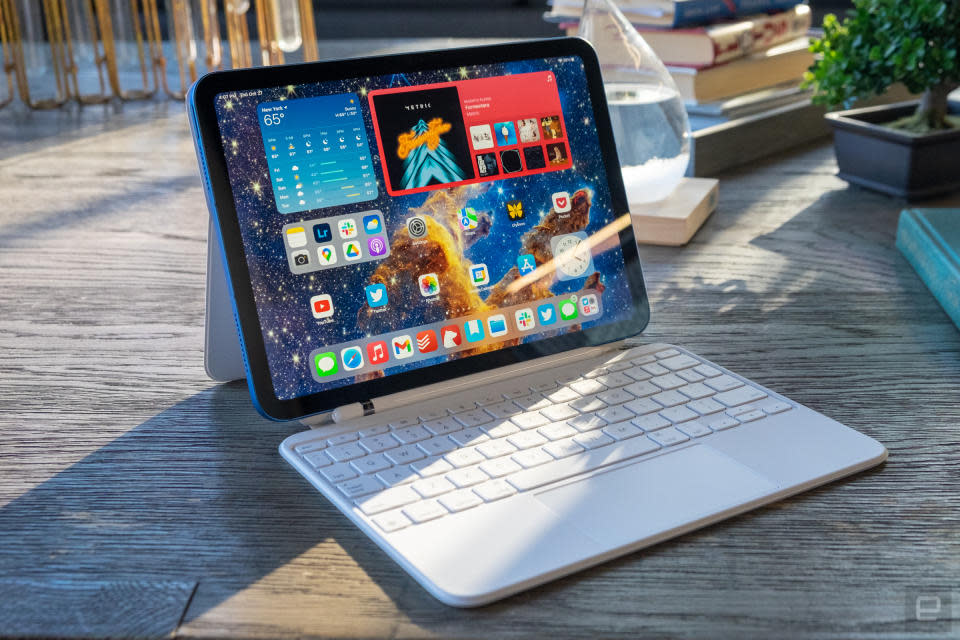 The 10th-gen iPad on an outdoor table with Magic Keyboard attached.
