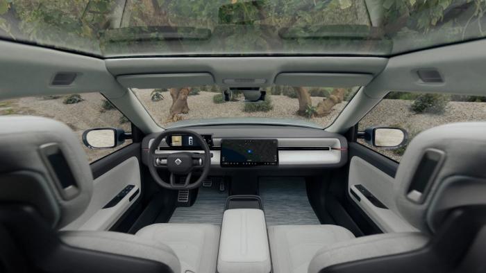 Front seats and dashboard of a Rivian vehicle.