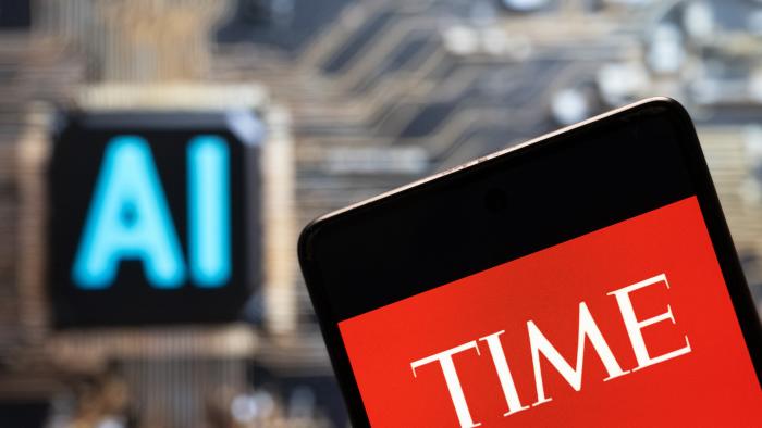 CHINA - 2023/11/03: In this photo illustration, the American weekly news magazine and news website Time logo seen displayed on a smartphone with an Artificial intelligence (AI) chip and symbol in the background. (Photo Illustration by Budrul Chukrut/SOPA Images/LightRocket via Getty Images)