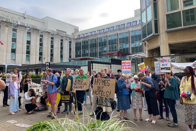 Protesters gathered outside Brighton Town Hall to oppose the plans (PA)