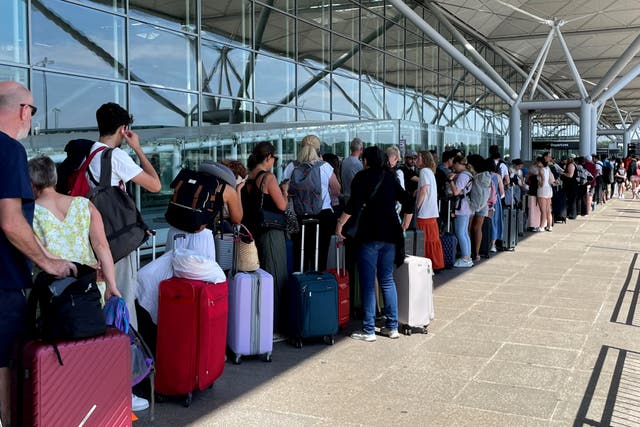 Thousands of passengers suffered flight delays and cancellations on Friday due to the IT outage (Joe Giddens/PA)